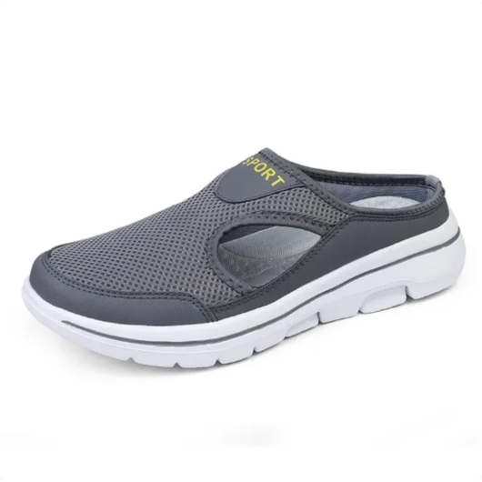 Slip-on sko i grå mesh med sort kant og hvid sål, set fra siden med åben hæl